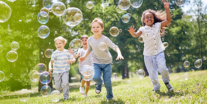 Kids playing with bubbles