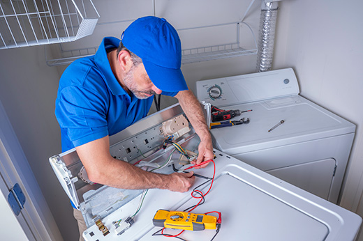 Technician working on washing machine
