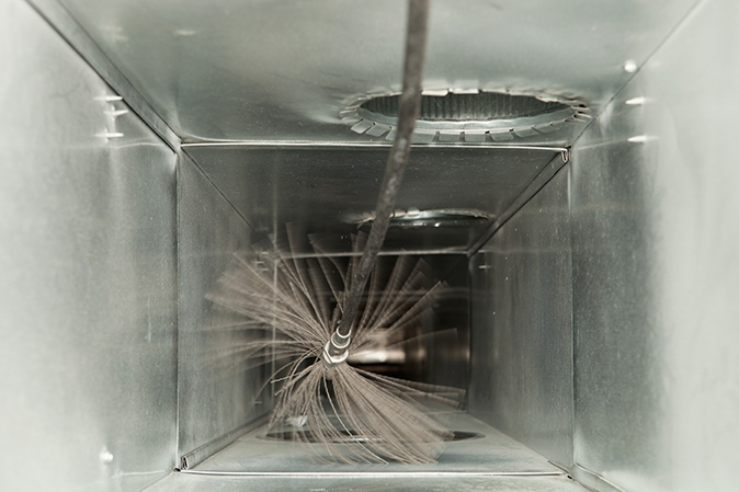 An HVAC air duct being cleaned