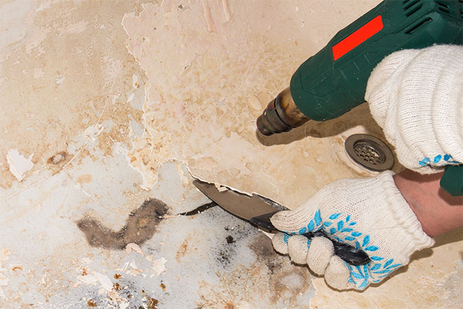 Image of damaged tub shows pattern of cracks.
