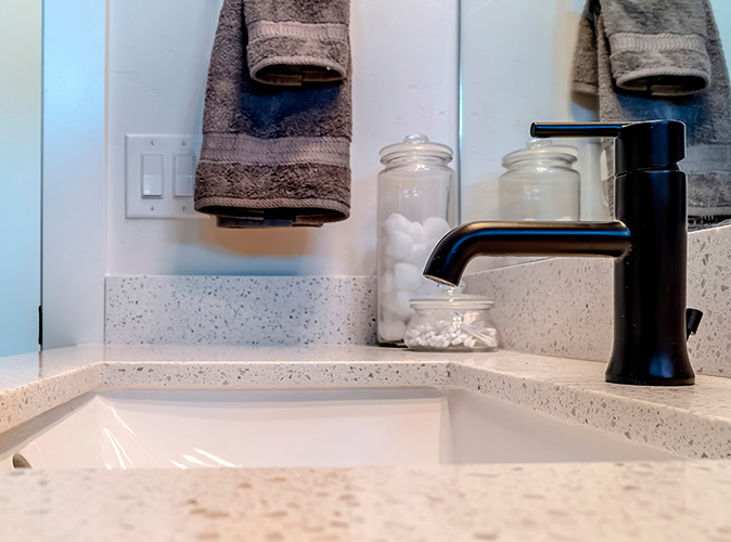 A ball-style faucet in a modern bathroom.