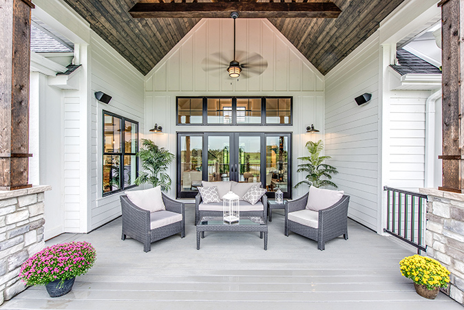 Outdoor seating area with large ceiling fan