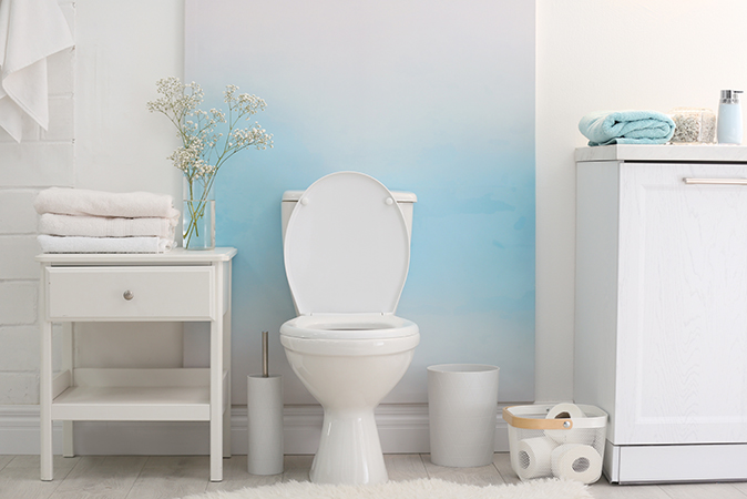 A clean, white bathroom with sparkling appliances and fixtures.