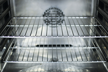 Interior view of an oven looking shiny and clean
