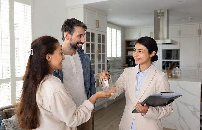 A woman reviews a mortgage document just before signing the paperwork.