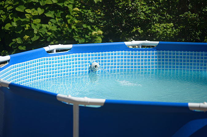 A partially drained above-ground pool.