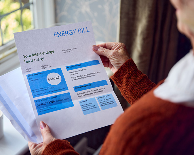 A homeowner looks at their monthly energy bill.