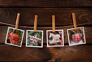 Hanging photos is one of many holiday decorating ideas that won't damage your walls