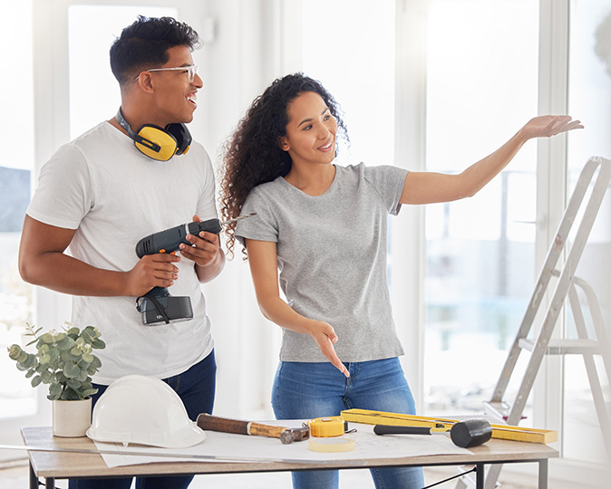 A couple works together on home improvement projects.