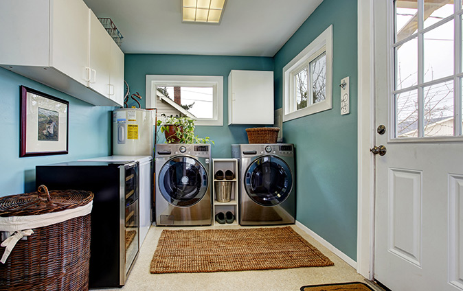 A laundry room with stainless steel appliances.