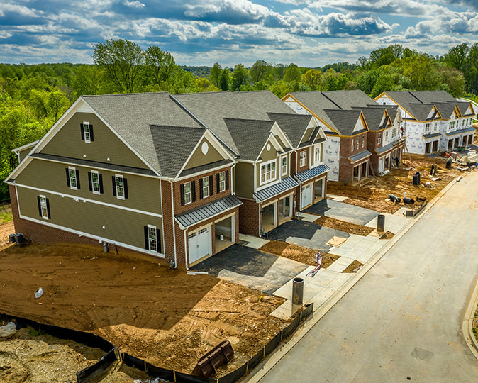 New homes still under construction in a neighborhood still being developed.