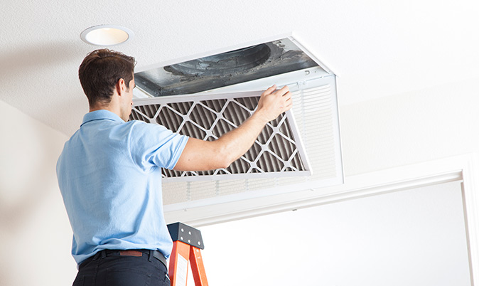 An open ceiling grille where some air filters can be found in central air conditioning systems.