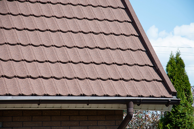A new composite roof on a house is covered by First American’s home warranty roof leak coverage.