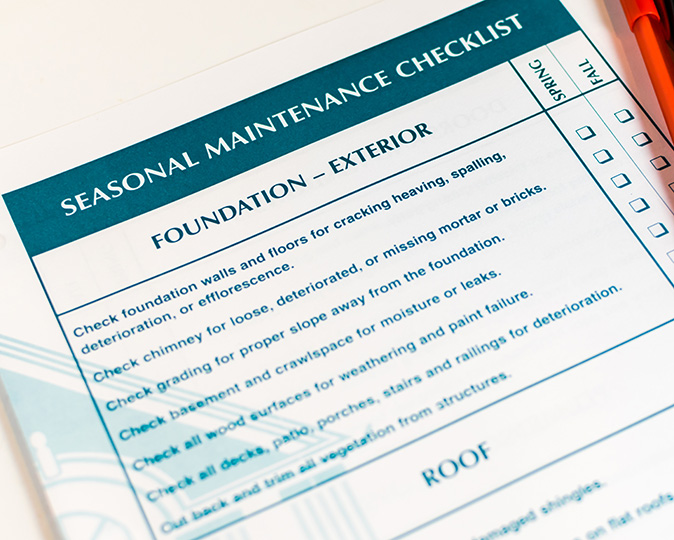 Closeup of a seasonal preventive home maintenance to-do list.
