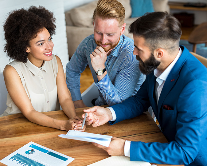 Real estate agent goes over owner’s policy of title insurance.