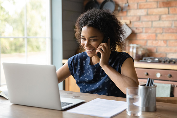 A woman makes a phone call to request service since she is outside the home warranty waiting period.